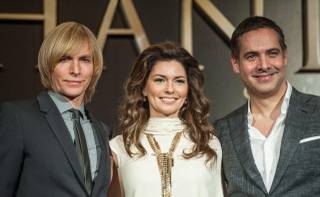 Fashion designer Marc Bouwer (in suit and tie), singer Shania Twain and director Raj Kapoor (suit, no tie) attend a press conference at Caesars Palace on Friday, Nov. 30, 2012.